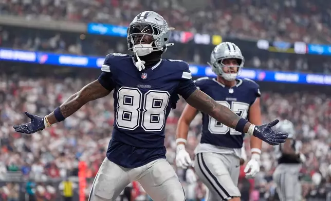Dallas Cowboys wide receiver Ceedee Lamb celebrates his touchdown during the second half of an NFL football game against the Houston Texans in Houston, Sunday, Oct. 4, 2026. (AP Photo/Ashley Landis)