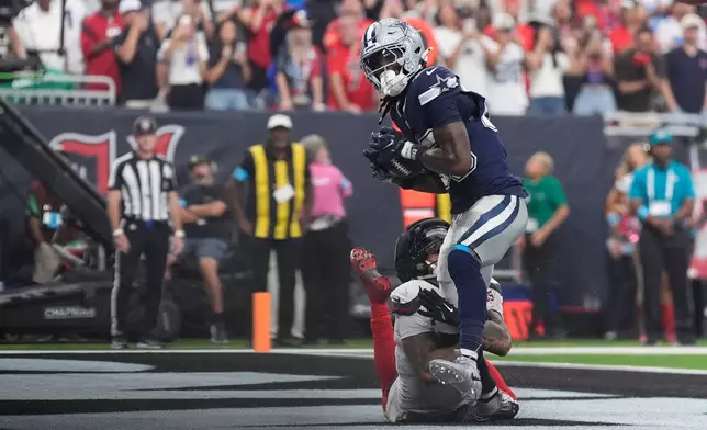 Dallas Cowboys wide receiver Ceedee Lamb makes a touchdown catch during the second half of an NFL football game against the Houston Texans in Houston, Sunday, Oct. 4, 2026. (AP Photo/Ashley Landis)