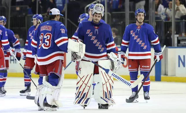 New York Rangers goaltender Igor Shesterkin, center, after an NHL hockey game against the Tampa Bay Lightning Thursday, Oct. 1, 2026, in New York. (AP Photo/Pamela Smith)