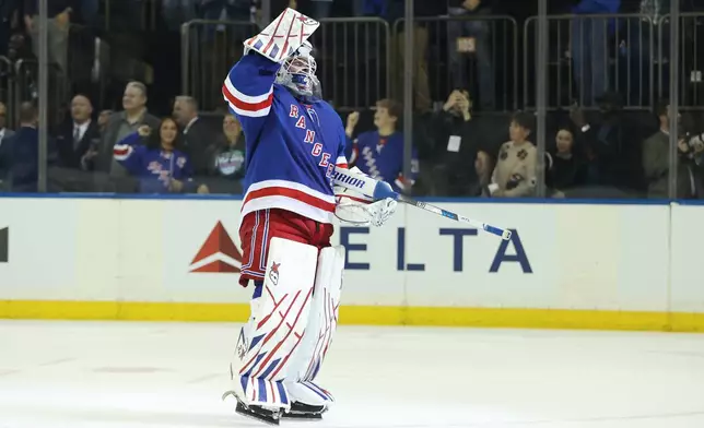 New York Rangers goaltender Igor Shesterkin reacts after scoring a goal during the third period of an NHL hockey game against the Tampa Bay Lightning Thursday, Oct. 1, 2026, in New York. (AP Photo/Pamela Smith)