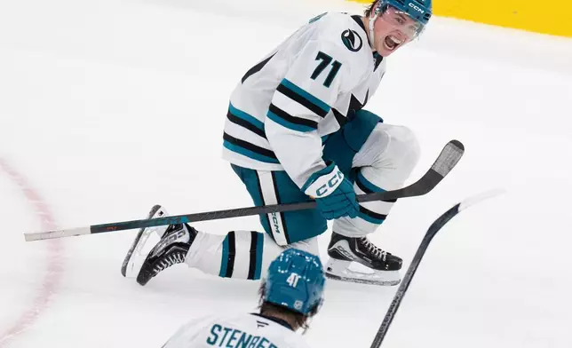 San Jose Sharks' Macklin Celebrini (71) celebrates his game-winning goal over the Montreal Canadiens during overtime in an NHL hockey game in Montreal, Tuesday, Oct. 20, 2026. (Christinne Muschi/The Canadian Press via AP)