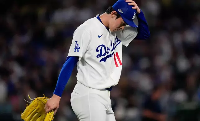 Los Angeles Dodgers pitcher Roki Sasaki leaves the game during the eighth inning of Game 3 of baseball's National League Championship Series between the Milwaukee Brewers and the Los Angeles Dodgers, Wednesday, Oct. 14, 2026, in Los Angeles. (AP Photo/Ashley Landis)