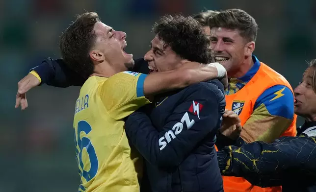 Frosinone's Matteo Cichella, left, celebrates with teammates after scoring a goal during the Serie A EniLive soccer match between Frosinone and Lecce Thursday, Oct. 29, 2026, in Frosinone, Italy. (Alfredo Falcone//LaPresse via AP)