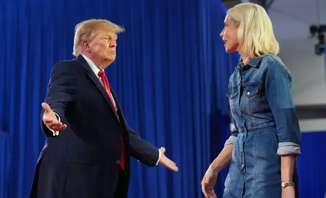 President Donald Trump greets Iowa U.S. Senate candidate Rep. Ashley Hinson, R-Iowa, at a campaign rally at Sioux Gateway Airport, Thursday, Oct. 22, 2026, in Sioux City, Iowa. (AP Photo/Alex Brandon)