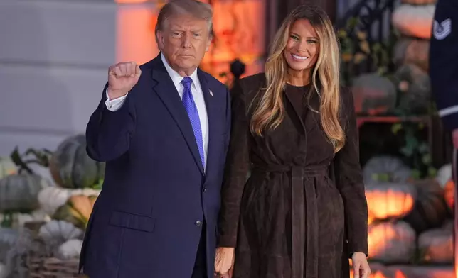 President Donald Trump and first lady Melania Trump attend a Halloween event on the South Lawn of the White House, Thursday, Oct. 29, 2026, in Washington. (AP Photo/J. Scott Applewhite)
