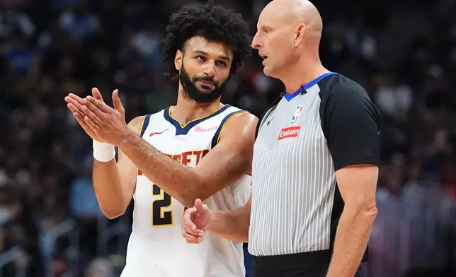 Denver Nuggets guard Jamal Murray, left, argues for a call with referee Eric Dalen in the first half of a preseason NBA basketball game against the Chicago Bulls Sunday, Oct. 11, 2026, in Denver. (AP Photo/David Zalubowski)