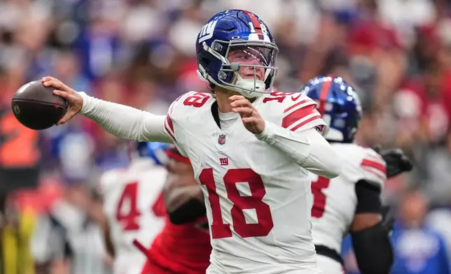 New York Giants quarterback J.J. McCarthy (18) looks to throw a pass during the second half of an NFL football game against the Houston Texans in Houston, Sunday, Oct. 25, 2026. (AP Photo/Eric Smith)
