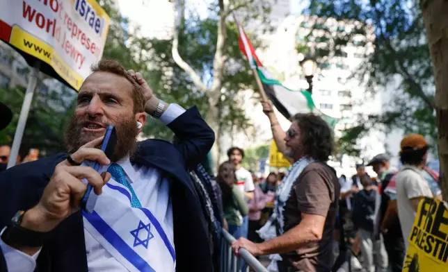 FILE - Rabbi Shmuley Boteach confronts pro-Palestinian demonstrators outside United Nations headquarters, Friday, Sept. 26, 2025, in New York. (AP Photo/Stefan Jeremiah, File)