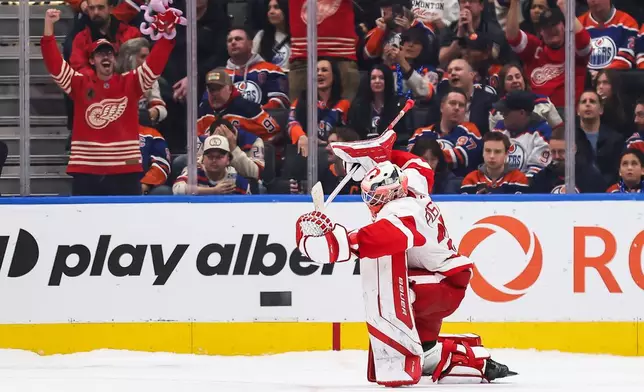 Detroit Red Wings goaltender Michal Postava (35) celebrates his team's victory against the Edmonton Oilers following NHL shootout hockey action in Edmonton, Alberta, Monday, Oct. 26, 2026. (Codie McLachlan/The Canadian Press via AP)