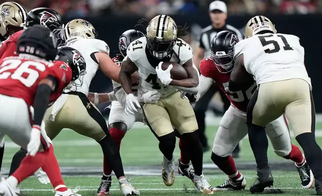 New Orleans Saints running back Alvin Kamara (41) runs against the Atlanta Falcons during the first half of an NFL football game in New Orleans, Monday, Oct. 5, 2026. (AP Photo/Gerald Herbert)