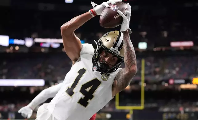 New Orleans Saints wide receiver Devaughn Vele (14) catches a touchdown pass against the Atlanta Falcons during the second half of an NFL football game in New Orleans, Monday, Oct. 5, 2026. (AP Photo/Gerald Herbert)