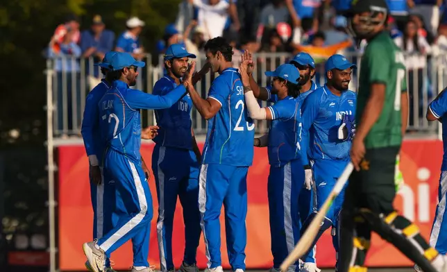 India's Shivam Dube, third from left, and team celebrate the wicket of Pakistan's Saim Ayub during the gold medal cricket match between India and Pakistan at the Asian Games in Nagoya, Japan, Saturday, Oct. 3, 2026. (AP Photo/Mark Baker)