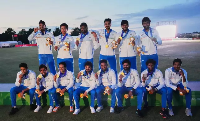 Gold medalists, Indian team members pose on the podium after the medal ceremony for cricket at the Asian Games in Nagoya, Japan, Saturday, Oct. 3, 2026. (AP Photo/Mark Baker)