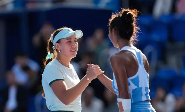 Kamilla Rakhimova of Uzbekistan congratulates Leylah Fernandez of Canada after their singles semifinal match at the Pan Pacific Open tennis tournament Saturday, Oct. 31, 2026, in Tokyo. (AP Photo/Eugene Hoshiko)