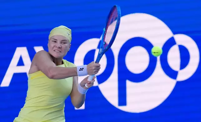 Diana Shnaider of Russia returns a shot against Mia Pohankova of Slovakia during their singles semifinal match at the Pan Pacific Open tennis tournament in Tokyo, Saturday, Oct. 31, 2026. (AP Photo/Eugene Hoshiko)