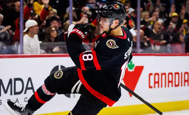 Ottawa Senators' Tim Stutzle (18) celebrates his goal against the Nashville Predators during second period of an NHL hockey game in Ottawa, Ontario, Saturday, Oct. 10, 2026. (Keito Newman/The Canadian Press via AP)