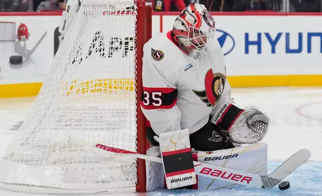 Ottawa Senators goaltender Linus Ullmark makes a save during the second period of an NHL hockey game against the New Jersey Devils in Newark, N.J., Monday, Oct. 12, 2026. (AP Photo/Seth Wenig)