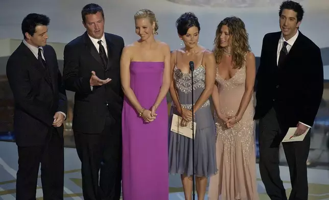 FILE - The cast of television's "Friends", from left: Matt LeBlanc, Matthew Perry, Lisa Kudrow, Courteney Cox Arquette, Jennifer Aniston and David Schwimmer appear during the 54th Annual Primetime Emmy Awards Sunday, Sept. 22, 2002, at the Shrine Auditorium in Los Angeles. (AP Photo/Kevork Djansezian, File)