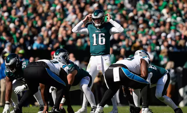 Philadelphia Eagles quarterback Tanner McKee (16) gestures during the first half of an NFL football game against the Carolina Panthers in Philadelphia, Sunday, Oct. 18, 2026. (AP Photo/Matt Slocum)