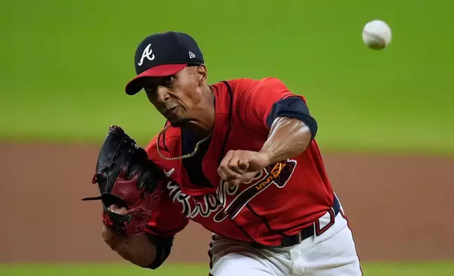 Atlanta Braves pitcher Ray Kerr throws against the Philadelphia Phillies in the first inning during Game 3 of baseball's NL Wild Card Series, Thursday, Oct. 1, 2026, in Atlanta. (AP Photo/Mike Stewart)