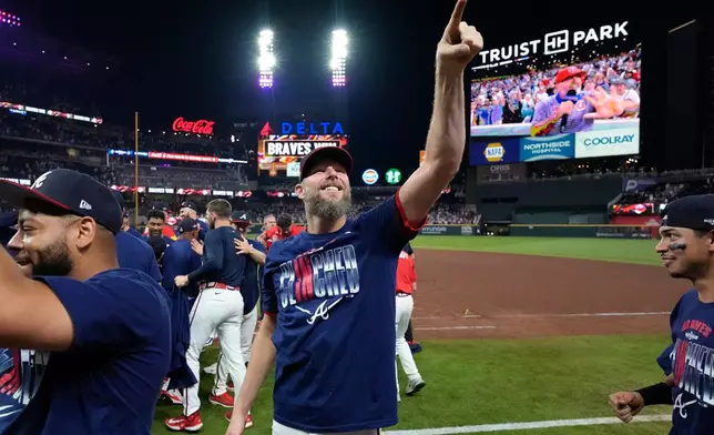 Atlanta Braves pitcher Chris Sale points ot the crowd after Game 3 of baseball's NL Wild Card Series against the Philadelphia Phillies, Thursday, Oct. 1, 2026, in Atlanta. (AP Photo/Brynn Anderson)