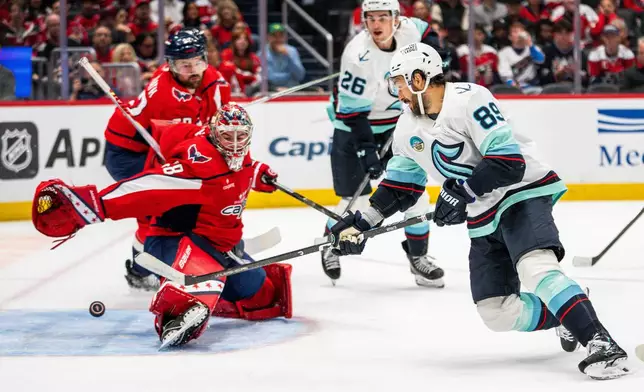 Seattle Kraken center Frederick Gaudreau (89) scores in action during the second period of an NHL hockey game against the Washington Capitals, Sunday, Oct. 11, 2026, in Washington. (AP Photo/Nathan Howard)