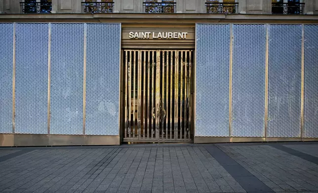 Exterior view of a shop of the Saint Laurent fashion company before protests over living costs and education in Paris, France, Saturday, Oct. 31, 2026. (AP Photo/Emma Da Silva)