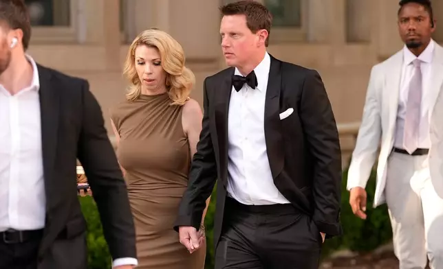 CEO of Paramount Skydance David Ellison, right, and wife Sandra Lynn Modic walk to the White House to attend a state dinner hosted for China's President Xi Jinping, Thursday, Sept. 24, 2026, in Washington. (AP Photo/Carolyn Kaster)