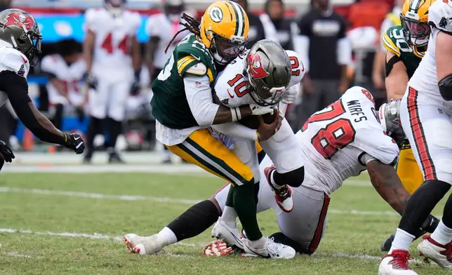 Green Bay Packers safety Xavier McKinney (29) sacks Tampa Bay Buccaneers quarterback Jalon Daniels (10) during the first half of an NFL football game in Tampa, Fla., Sunday, Oct. 4, 2026. (AP Photo/Chris O'Meara)