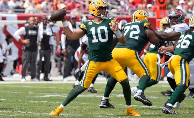 Green Bay Packers quarterback Jordan Love (10) aims a pass during an NFL football game against the Tampa Bay Buccaneers in Tampa, Fla., Sunday, Oct. 4, 2026. (AP Photo/Chris O'Meara)