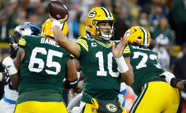 Green Bay Packers quarterback Jordan Love (10) throws a pass during the first half of an NFL football game against the Carolina Panthers in Green Bay, Wis., Thursday, Oct. 29, 2026. (AP Photo/Mike Roemer)