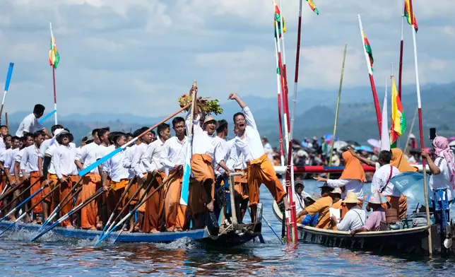 Ethnic Inthas celebrate during a traditional boat race to mark the Phaung Daw Oo pagoda festival on Inle Lake, southern Shan State, Myanmar, Friday, Oct. 16, 2026. (AP Photo/Thein Zaw)
