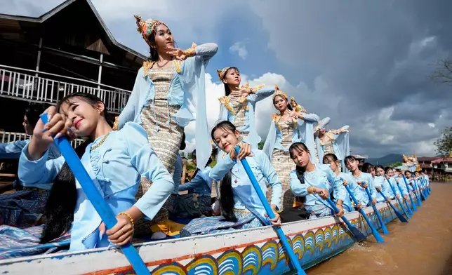 An ethnic Intha troupe performs during Phaung Daw Oo pagoda festival on Inle Lake, southern Shan State, Myanmar, Tuesday, Oct. 13, 2026. (AP Photo/Thein Zaw)