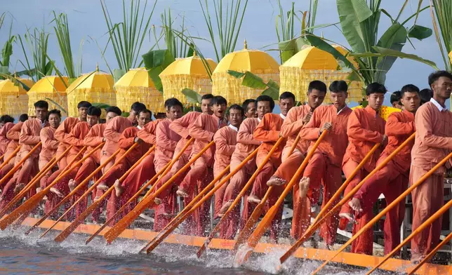 Ethnic Inthas row a boat during the Phaung Daw Oo pagoda festival on Inle Lake, southern Shan State, Myanmar, Thursday, Oct. 15, 2026. (AP Photo/Thein Zaw)