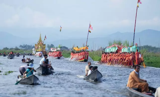 People participate in the Phaung Daw Oo pagoda festival on Inle Lake, southern Shan State, Myanmar, Thursday, Oct. 15, 2026. (AP Photo/Thein Zaw)