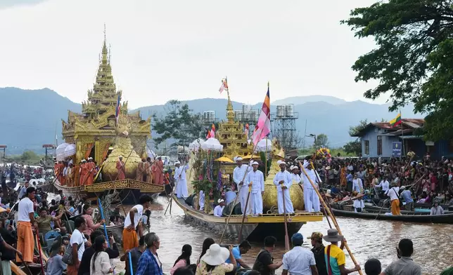 Barges carrying Buddha statues float on the Inle Lake during the Phaung Daw Oo pagoda festival in southern Shan State, Myanmar, Tuesday, Oct. 13, 2026. (AP Photo/Thein Zaw)