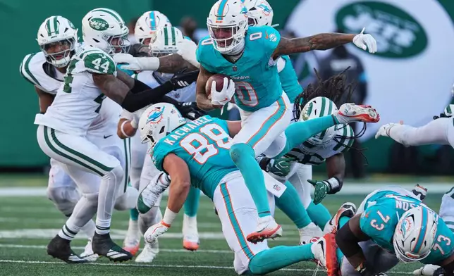 Miami Dolphins running back Ollie Gordon II (0) carries against the New York Jets in the second half of an NFL football game in East Rutherford, N.J., Sunday, Oct. 25, 2026. (AP Photo/Seth Wenig)