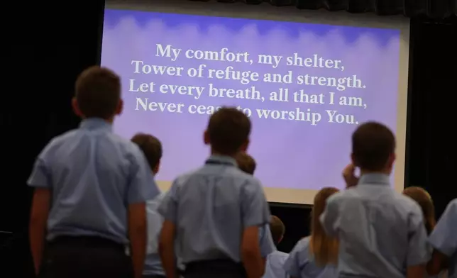 Students at Covenant Christian Academy look on a during chapel at the private school in Colleyville, Texas, Wednesday, Aug. 12, 2026. (AP Photo/LM Otero)