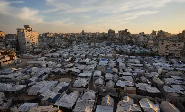 A makeshift tent camp for displaced Palestinians who lost their homes during the Israel-Hamas war stretches across Gaza City, Tuesday, Oct. 6, 2026. (AP Photo/Jehad Alshrafi)