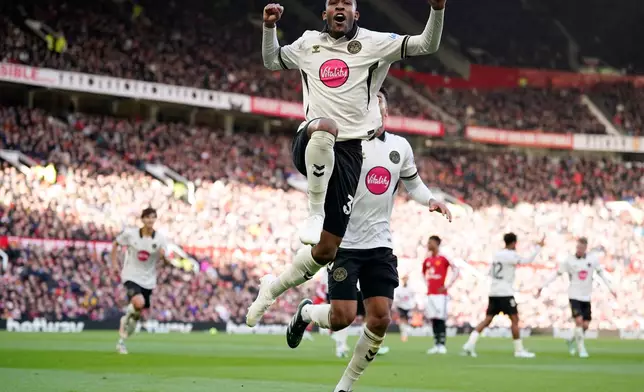 Bournemouth's Rayan celebrates scoring his side's first goal during the English Premier League soccer match between Manchester United and Bournemouth in Manchester, England, Sunday, Oct. 25, 2026. (AP Photo/Dave Thompson)