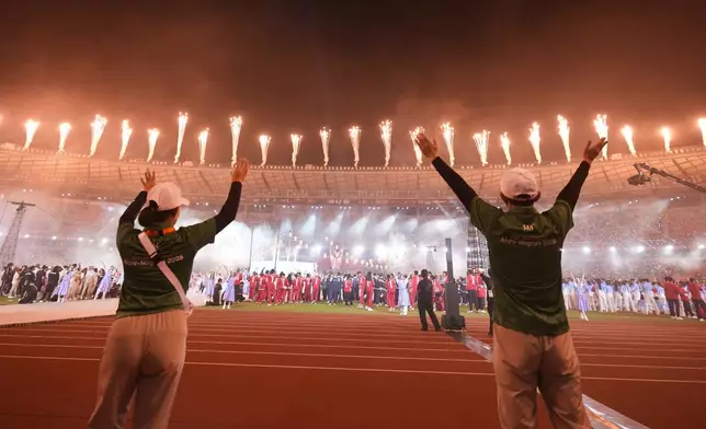 Fire works explode from the roof of the stadium during the closing ceremony for the Asian Games in Nagoya, Japan, Sunday, Oct. 4, 2026. (AP Photo/Lee Jin-man)