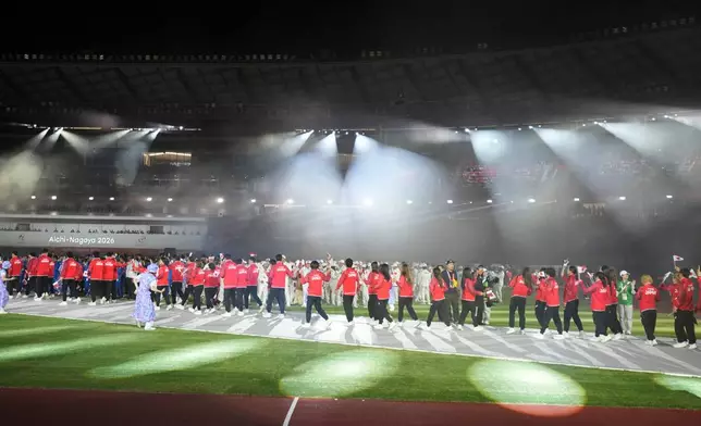 Athletes from Japan march into the arena during the closing ceremony for the Asian Games in Nagoya, Japan, Sunday, Oct. 4, 2026. (AP Photo/Lee Jin-man)