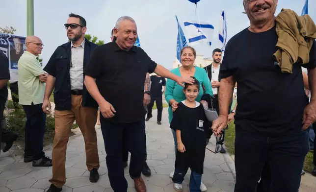 Gadi Eisenkot, leader of the Yashar ("Straight") party, visits a polling station in Ofakim, southern Israel, during the country's general election Tuesday, Oct. 27, 2026. (AP Photo/Ariel Schalit)