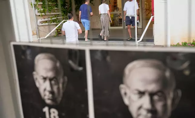 Voters arrive to cast their ballots in Israel's general election, in Tel Aviv, Israel, Tuesday, Oct. 27, 2026. (AP Photo/David Goldman)