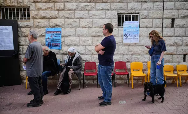 Voters line up before a polling site opens to cast their ballots in Israel's general election, in Jerusalem, Tuesday, Oct. 27, 2026, (AP Photo/Ohad Zwigenberg)