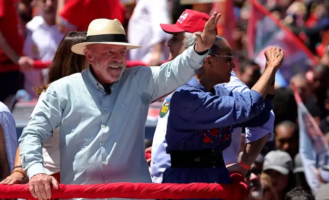 Brazilian President Luiz Inacio Lula da Silva, who is running for reelection, waves to supporters during a campaign rally in Sao Paulo, Brazil, Saturday, Sept. 26, 2026. (AP Photo/Allison Sales)
