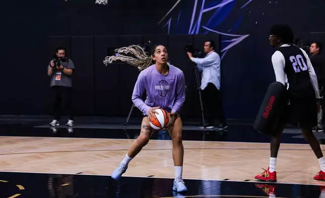 Golden State Valkyries forward Gabby Williams, center, runs a drill during a media day in Oakland, Calif., Friday, Oct. 16, 2026, ahead of Saturday's Game 1 of the WNBA basketball Finals against the Atlanta Dream. (Yalonda M. James/San Francisco Chronicle via AP)