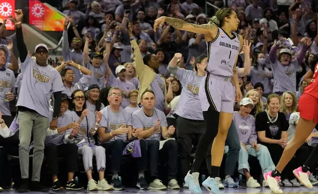 Fans cheer after Golden State Valkyries forward Gabby Williams (1) scored against the Atlanta Dream during the first half of Game 1 of the WNBA basketball finals, Saturday, Oct. 17, 2026, in San Francisco. (AP Photo/Jeff Chiu)