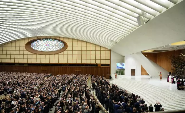 Pope Leo XIV arrives in the Paul VI Hall at the Vatican, Saturday, Oct. 31, 2026, for an audience with some 7,000 university representatives and supporters from Villanova University and the University of Notre Dame, including members of their men's and women's basketball teams, ahead of the Eternal City Tip-Off, a men's and women's college basketball doubleheader in Rome on Nov. 1. (AP Photo/Gregorio Borgia)