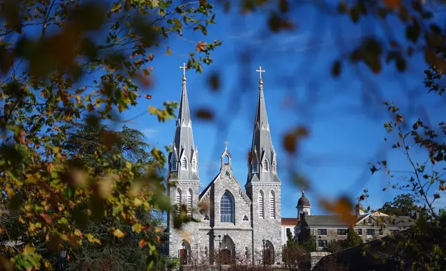 St. Thomas of Villanova Church is seen through autumn leaves at Villanova University in Villanova, Pa., Wednesday, Oct. 21, 2026. (AP Photo/Matt Rourke)